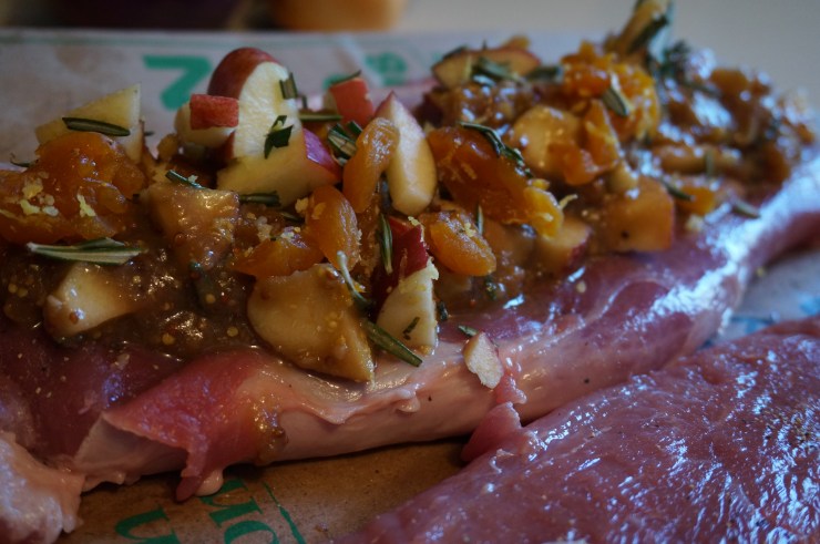 Spread the filling onto the pork.