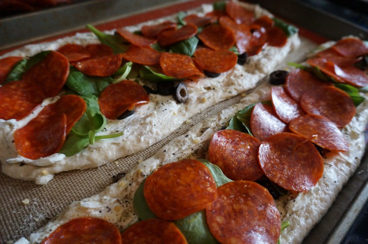 Add spinach and pepperoni on top.