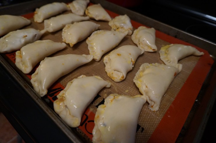 Seal with fingers or a fork and brush with egg.