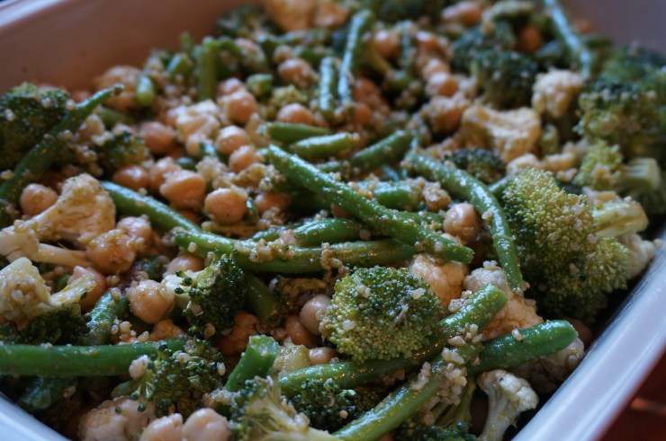 Prepare veggies in casserole dish with some of the pesto.