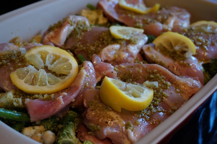 Layer chicken and lemon slices on top.