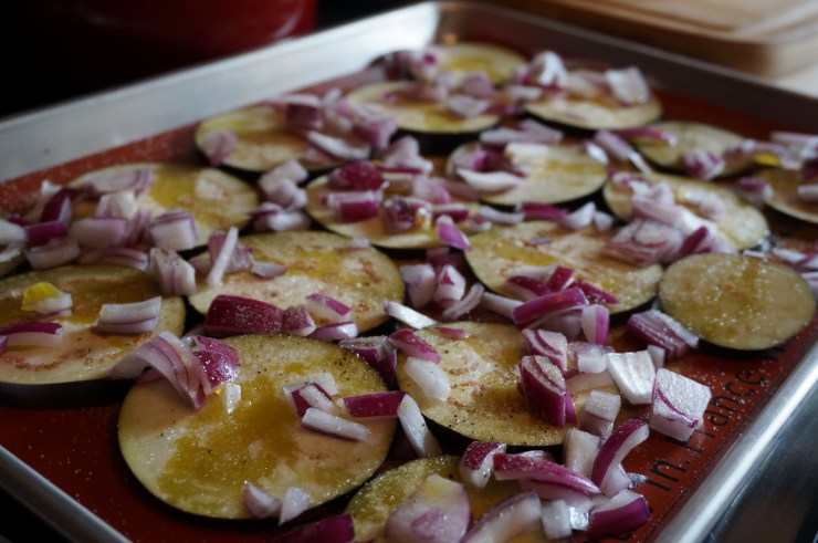 First, roast eggplant with onion and a drizzle of olive oil.