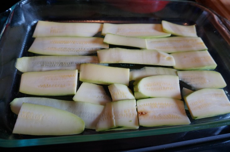 Start layering zucchini noodles first.